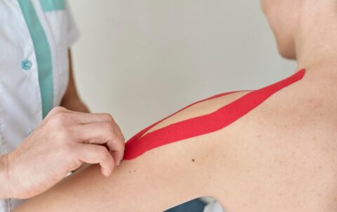 physiotherapist-undergoing-therapy-with-female-patient_23-2148836515