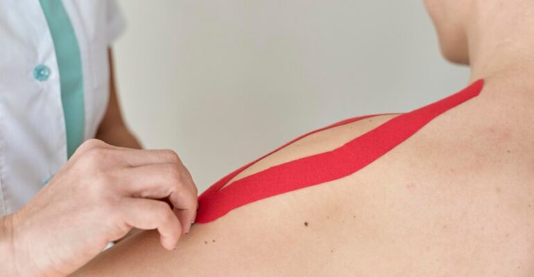 physiotherapist-undergoing-therapy-with-female-patient_23-2148836515
