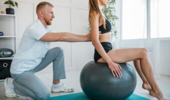 woman-doing-exercises-with-ball-and-physiotherapist_23-2148789851