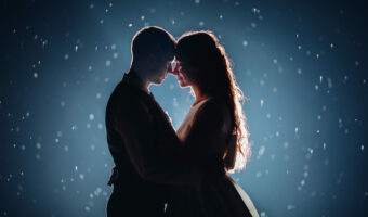 Gorgeous newlywed couple in the light.