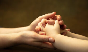 Close up of female and kid's hands doing things together, family, home concept